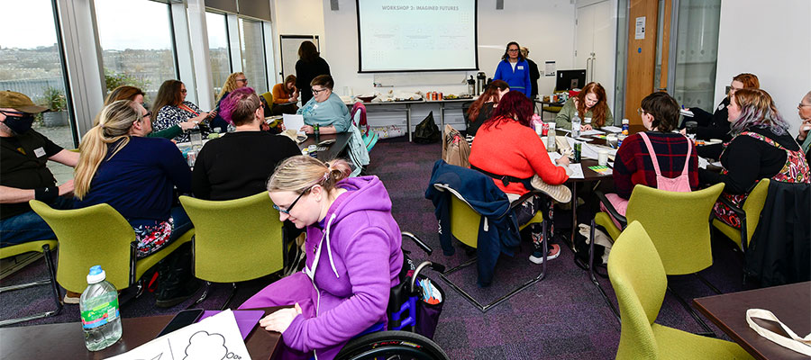 Ehlers-Danlos syndrome event. People working on worksheets in groups.