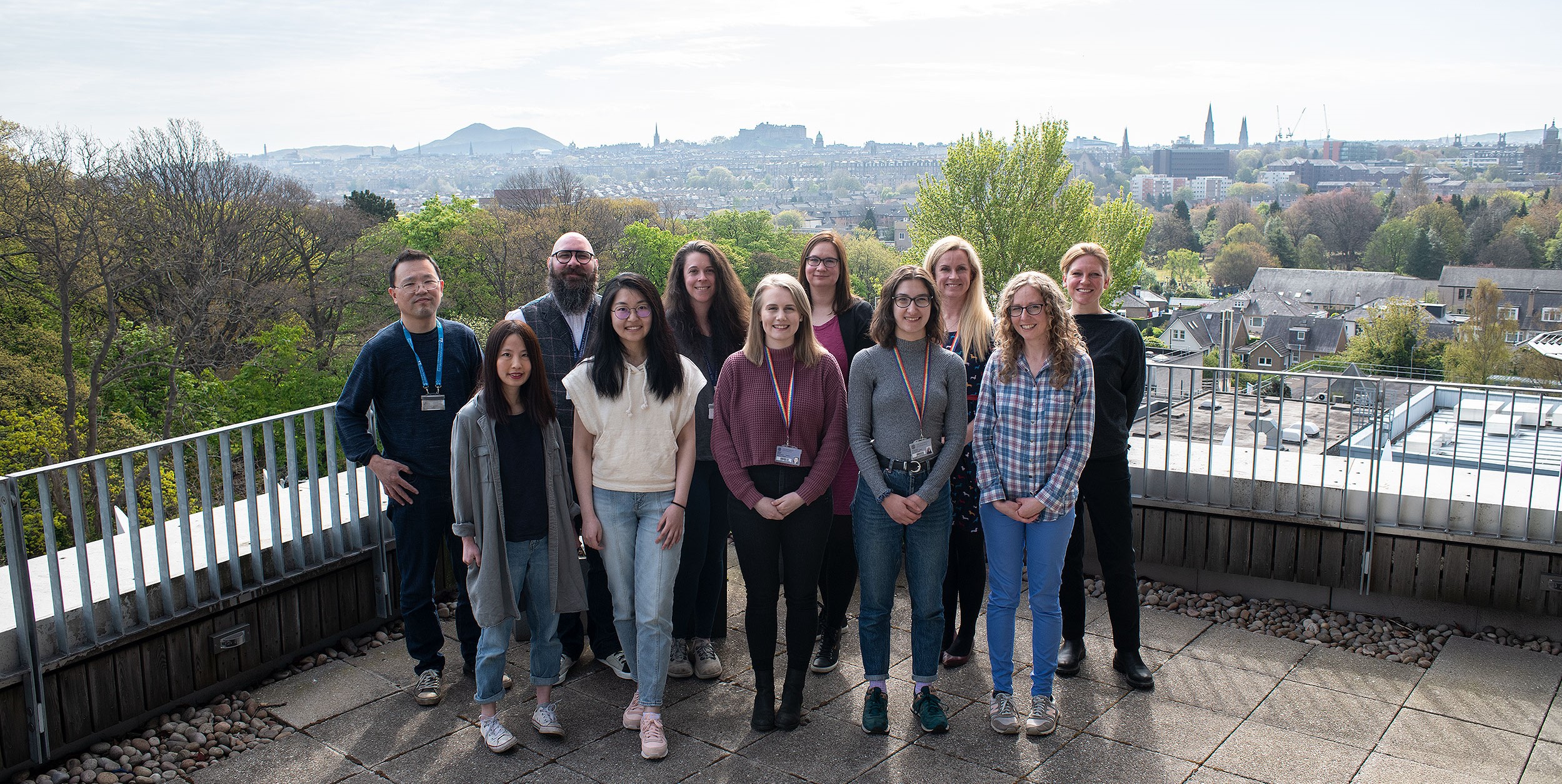 Liz Patton and her team on balcony overlooking Edinburgh