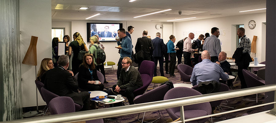 People chatting and enjoying refreshments